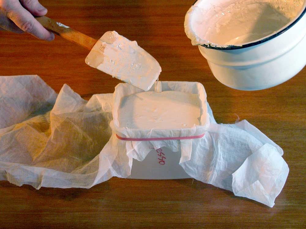Pouring gesso through cheese cloth
